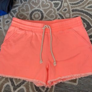 Stretch jeans like coral colored shorts